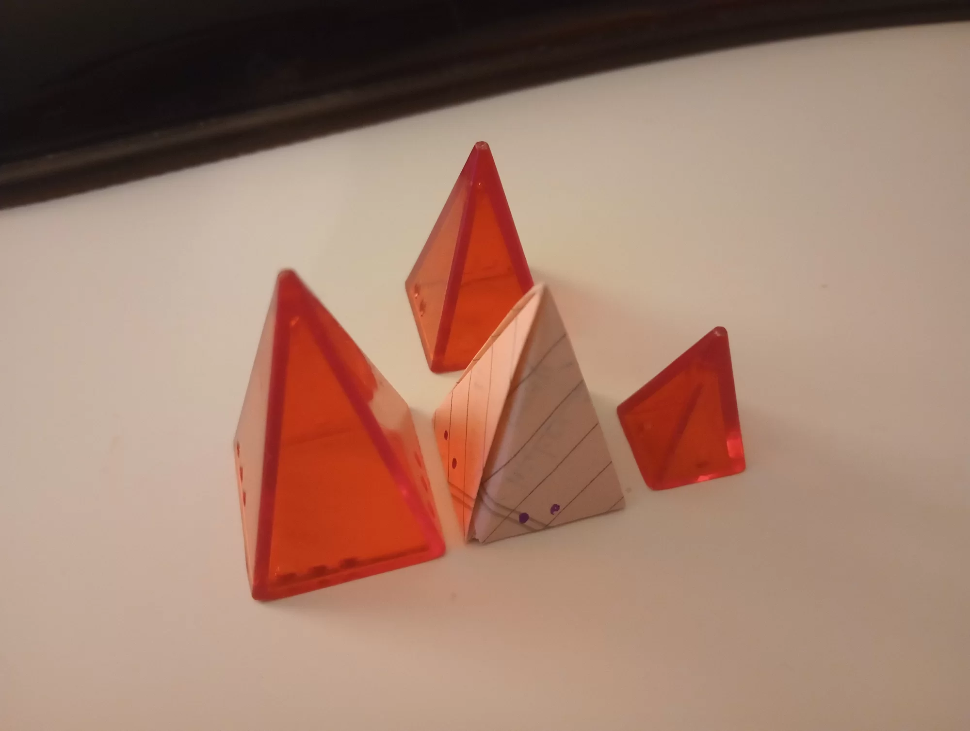 the paper pyramid compared to a plastic Looney Pyramid. it's about the same size.